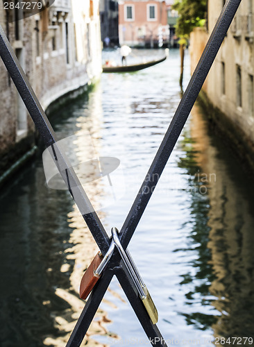 Image of Padlocks of lovers placed on the bridge