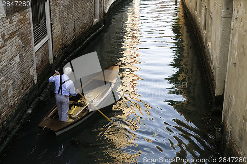 Image of Man on a boat in Venice