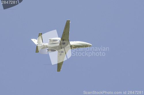 Image of Flying plane on blue sky background