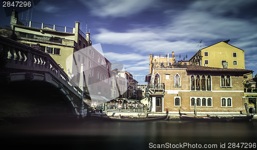 Image of Ancient buildings and boats in the channel in Venice