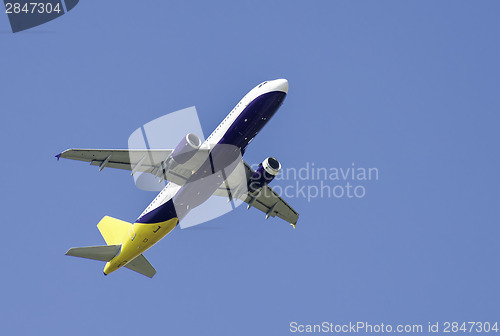 Image of Flying plane on blue sky background