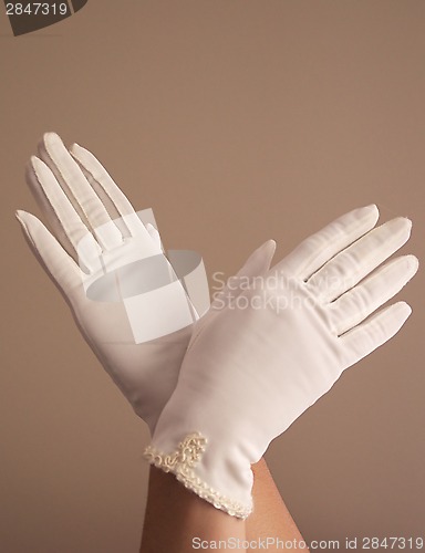 Image of woman modeling vintage formal white gloves
