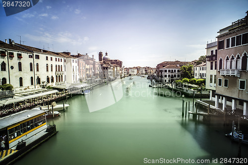 Image of Ancient buildings and boats in the channel in Venice