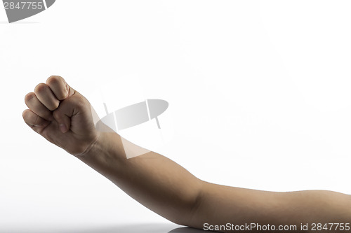 Image of Young hands make a fist gesture