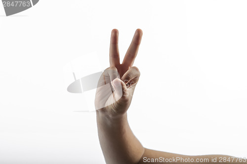 Image of Young hand make 2 fingers gesture