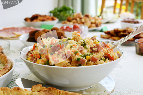 Image of Bowl of rice salad on a buffet table