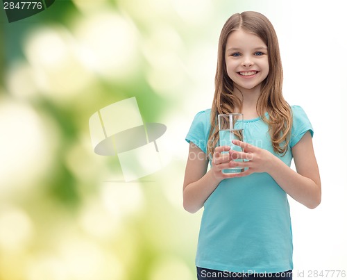 Image of smiling little girl with glass of water