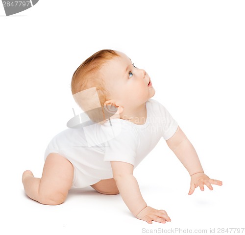 Image of crawling curious baby looking up