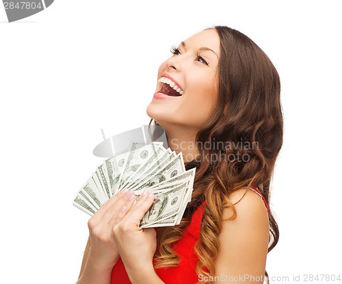 Image of woman in red dress with us dollar money