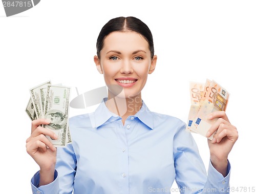 Image of businesswoman with dollar and euro cash money