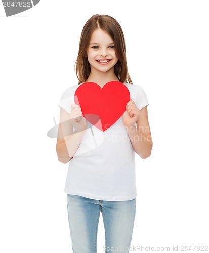 Image of smiling little girl with red heart