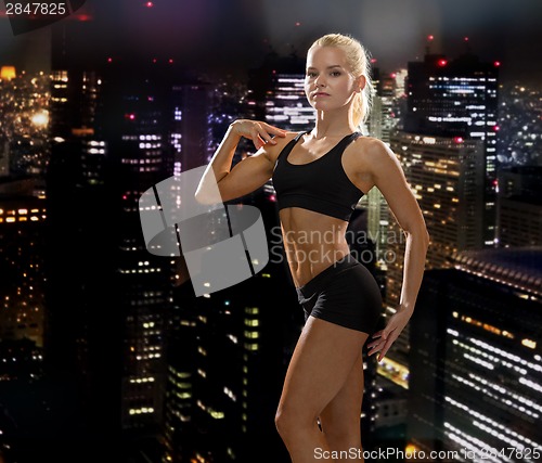 Image of beautiful athletic woman in sportswear