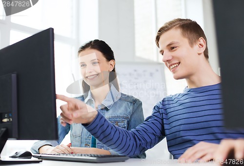 Image of two smiling students having discussion