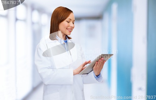 Image of smiling female doctor and tablet pc computer