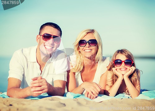 Image of happy family on the beach