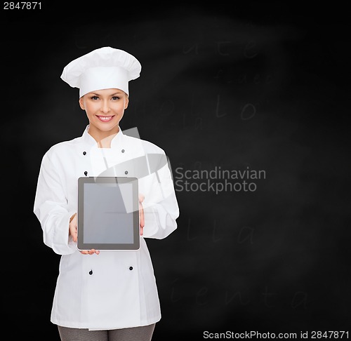 Image of smiling female chef with tablet pc blank screen