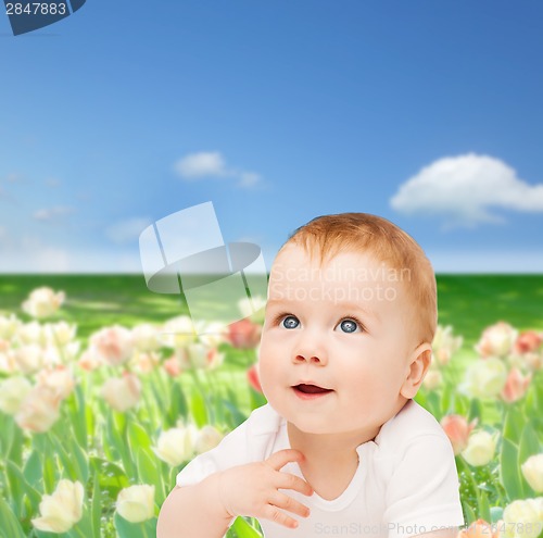 Image of smiling baby looking up