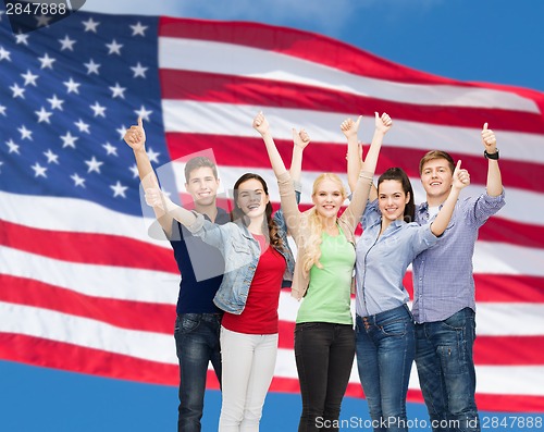 Image of group of smiling students showing thumbs up