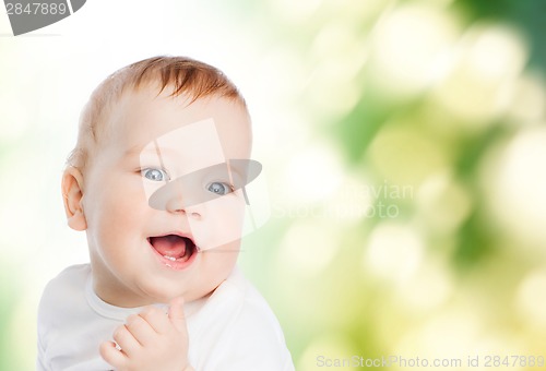 Image of close up of mother holding smiling baby