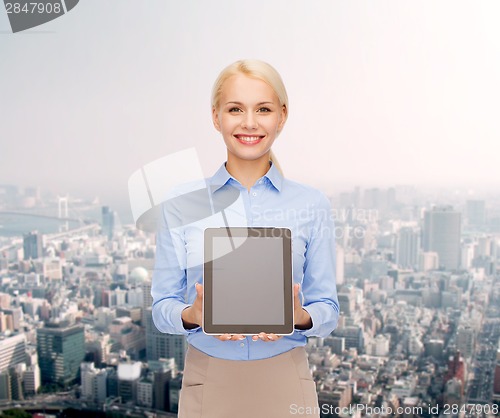 Image of businesswoman with blank black tablet pc screen