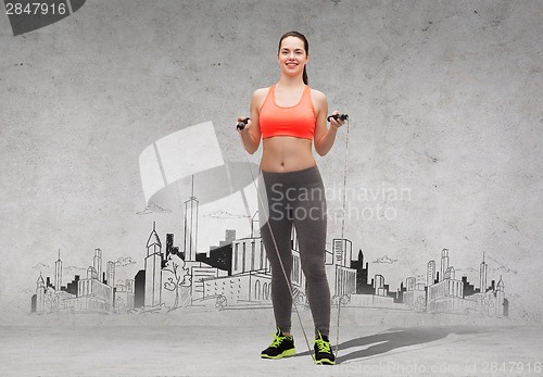 Image of sporty woman with skipping rope