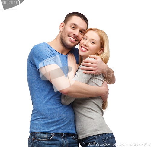 Image of smiling couple hugging