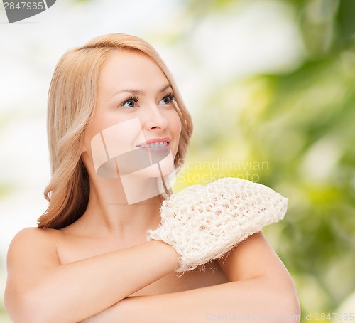 Image of smiling woman with exfoliation glove