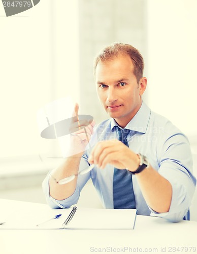 Image of businessman showing warning gesture