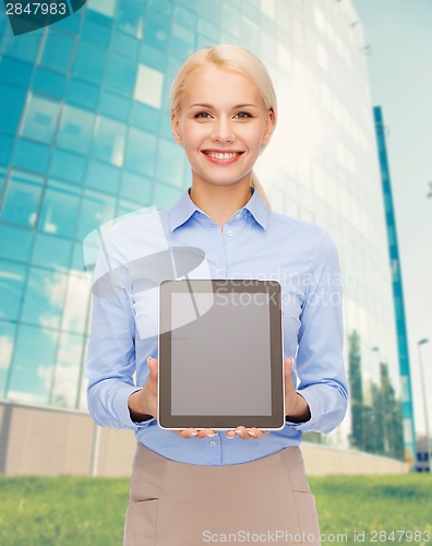 Image of businesswoman with blank black tablet pc screen