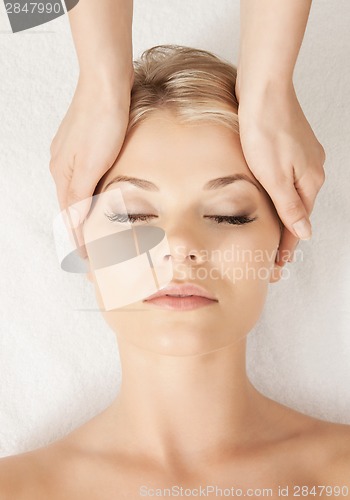 Image of beautiful woman in massage salon