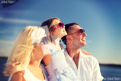 Image of happy family with blue sky