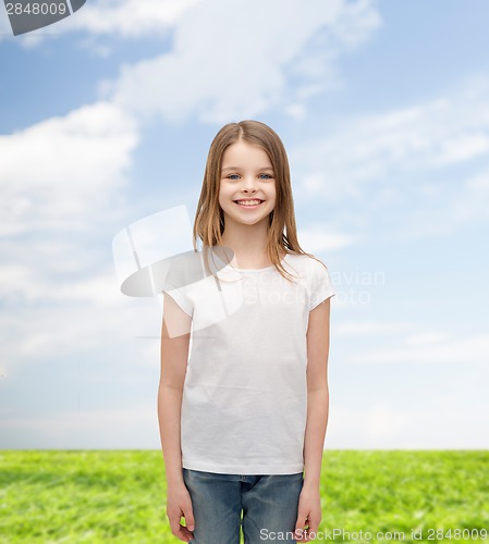 Image of smiling little girl in white blank t-shirt