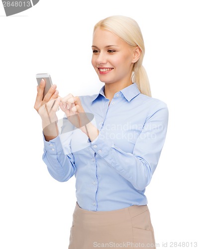 Image of young smiling businesswoman with smartphone