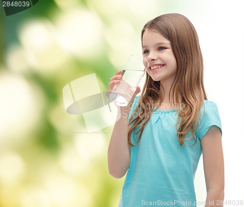 Image of smiling little girl with glass of water