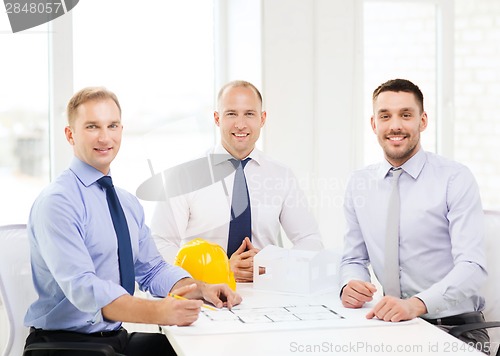 Image of happy team of architects and designers in office