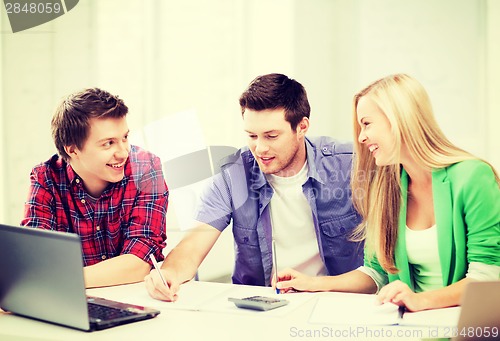 Image of students chatting in lecture at school