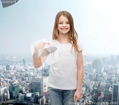 Image of smiling little girl in blank white t-shirt