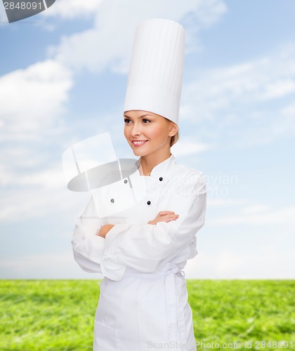 Image of smiling female chef with crossed arms