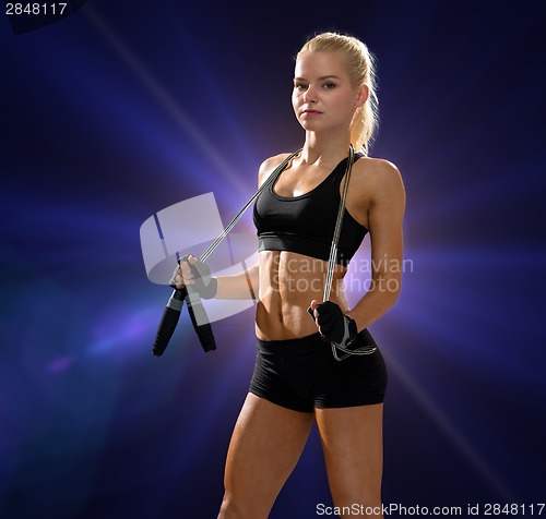 Image of sporty woman with skipping rope