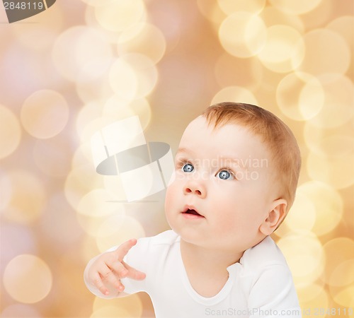 Image of curious baby looking up