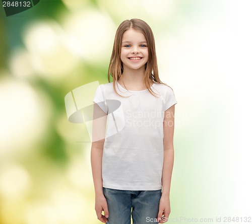 Image of smiling little girl in white blank t-shirt