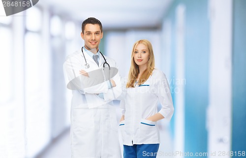 Image of two young attractive doctors in medical facility