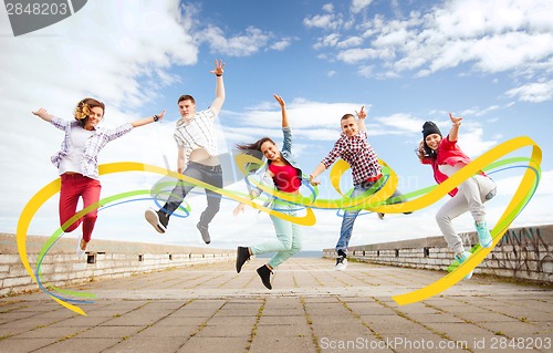 Image of group of teenagers jumping