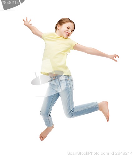 Image of smiling little girl jumping