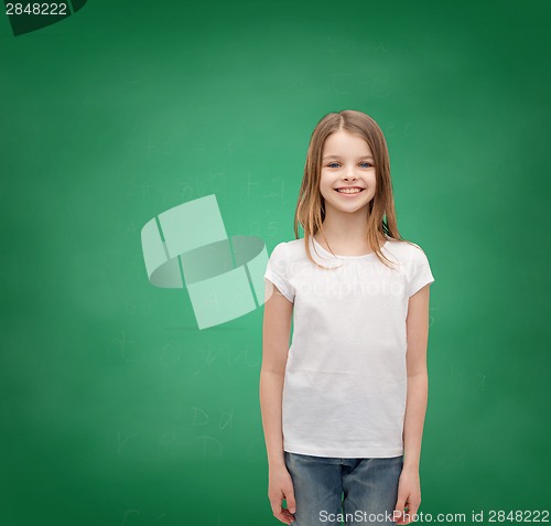 Image of smiling little girl in white blank t-shirt