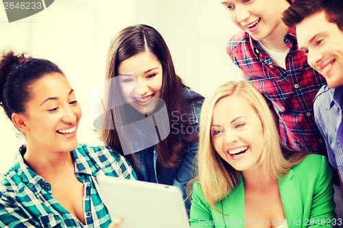 Image of students looking at tablet pc in lecture at school