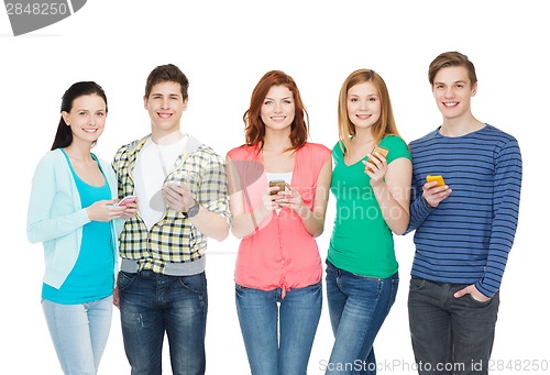 Image of smiling students with smartphones