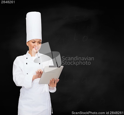 Image of smiling female chef with tablet pc computer