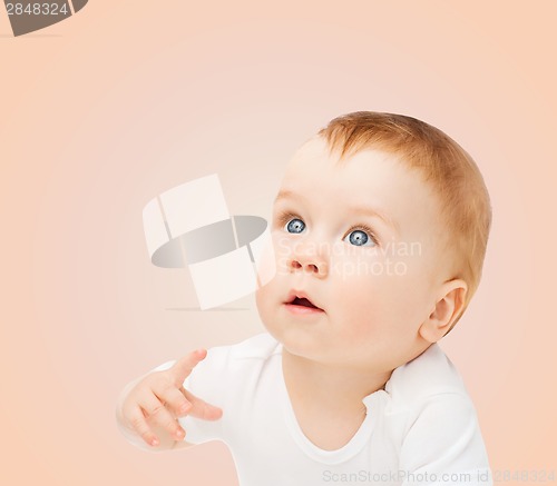 Image of curious baby looking up