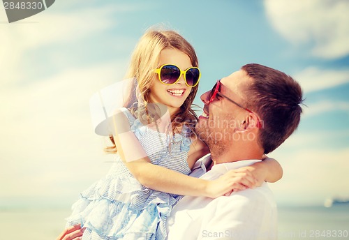 Image of happy father and child girl having fun outdoors
